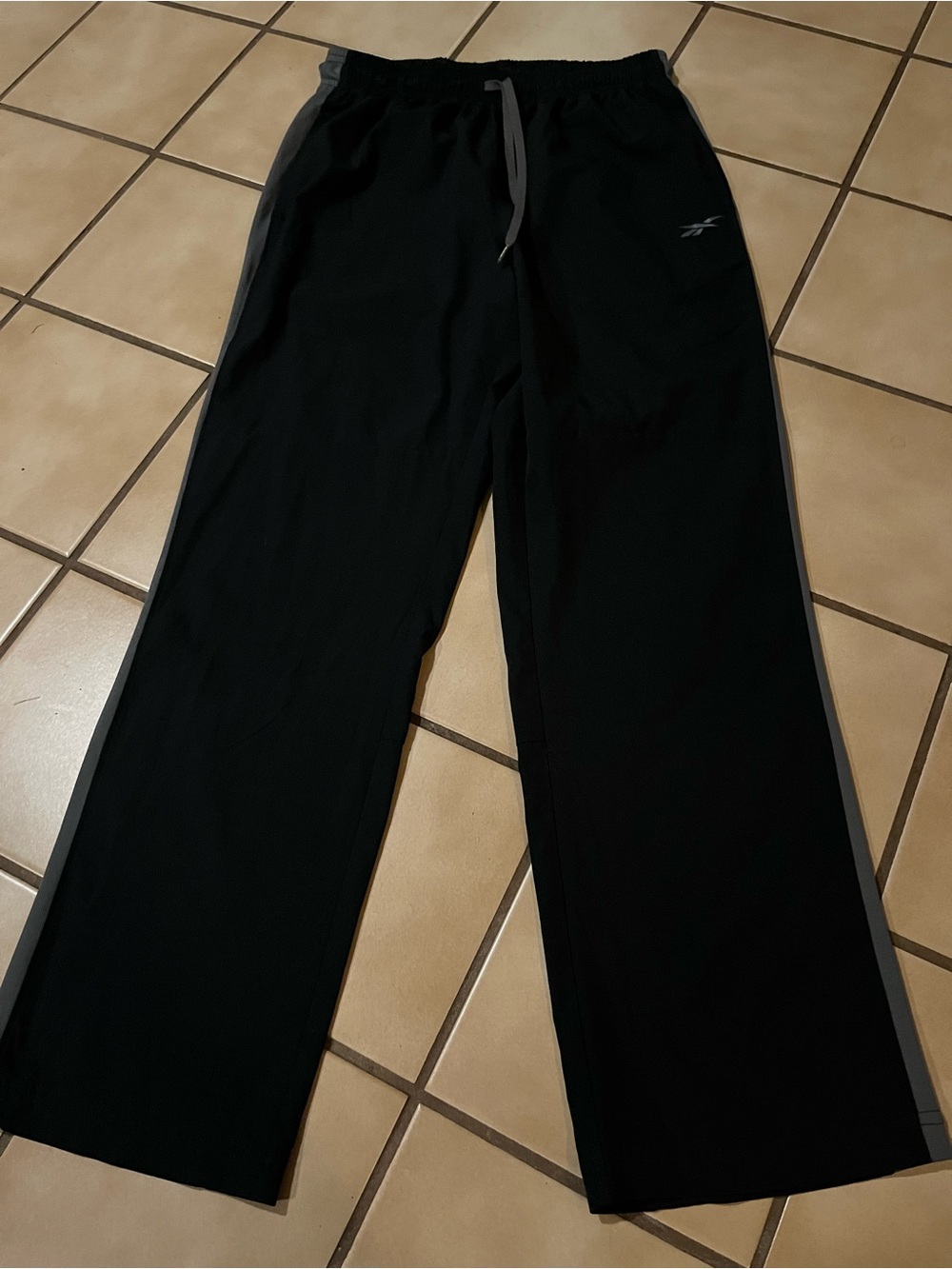Reebok women’s Black Joggers with Gray Side Stripes